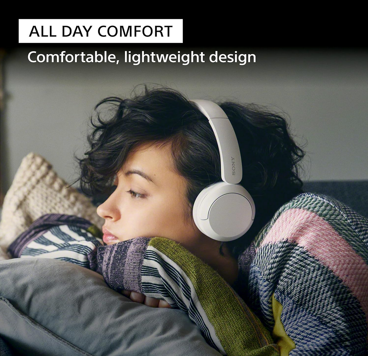 Sony WH-CH520 Bluetooth Headphones lifestyle image with user listening to music

